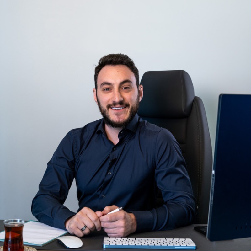 Okan Türkay, founder and CEO of Property Gulf, seated at his desk Okan Türkay, founder and CEO of Property Gulf, seated at his desk