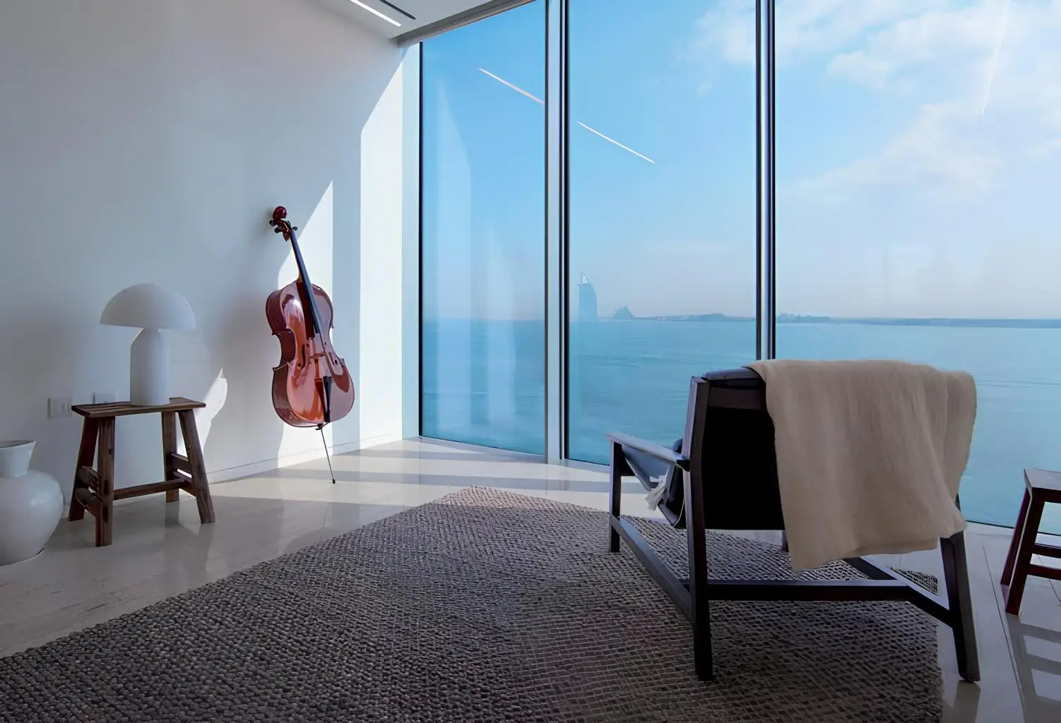 Music room beside full-height sea-view windows shown in the MURABA "Muraba Dia" catalogue, Dubai